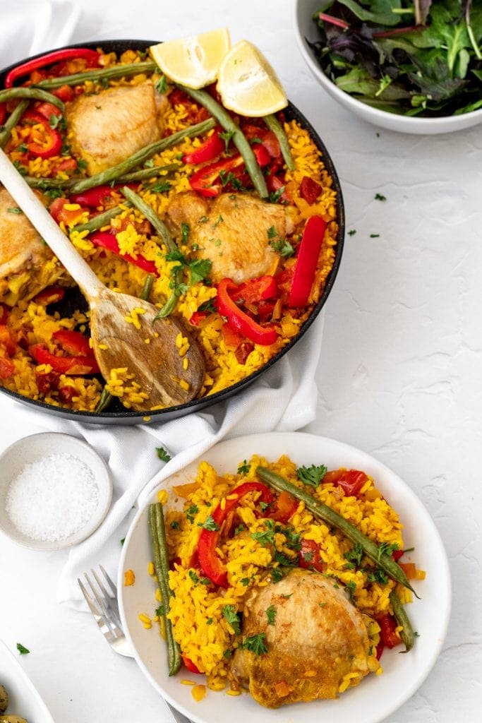 pan and plate of chicken chorizo paella
