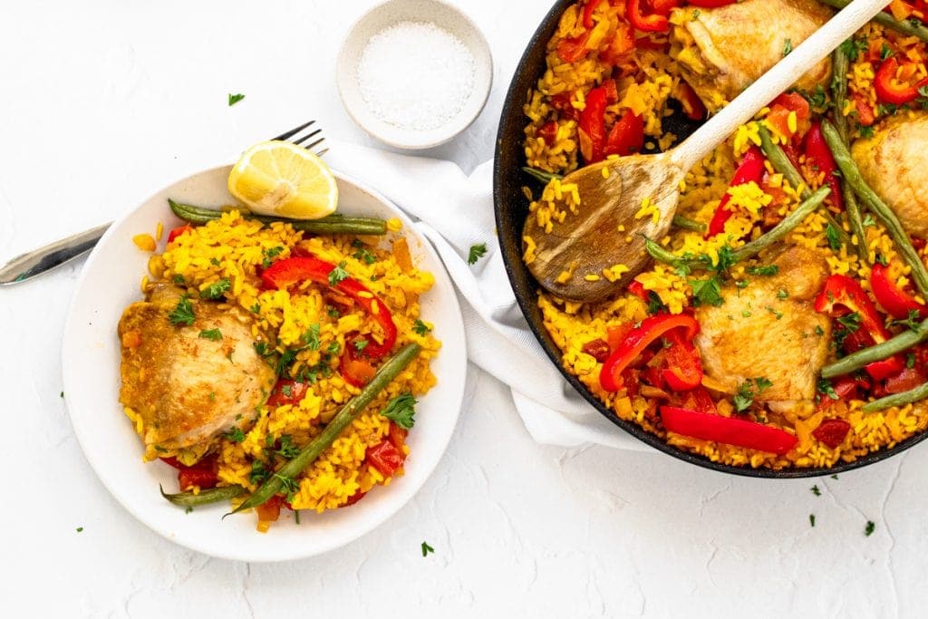 chicken and chorizo paella in pan and on plate