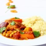 Plate of slow cooker chicken tagine with couscous