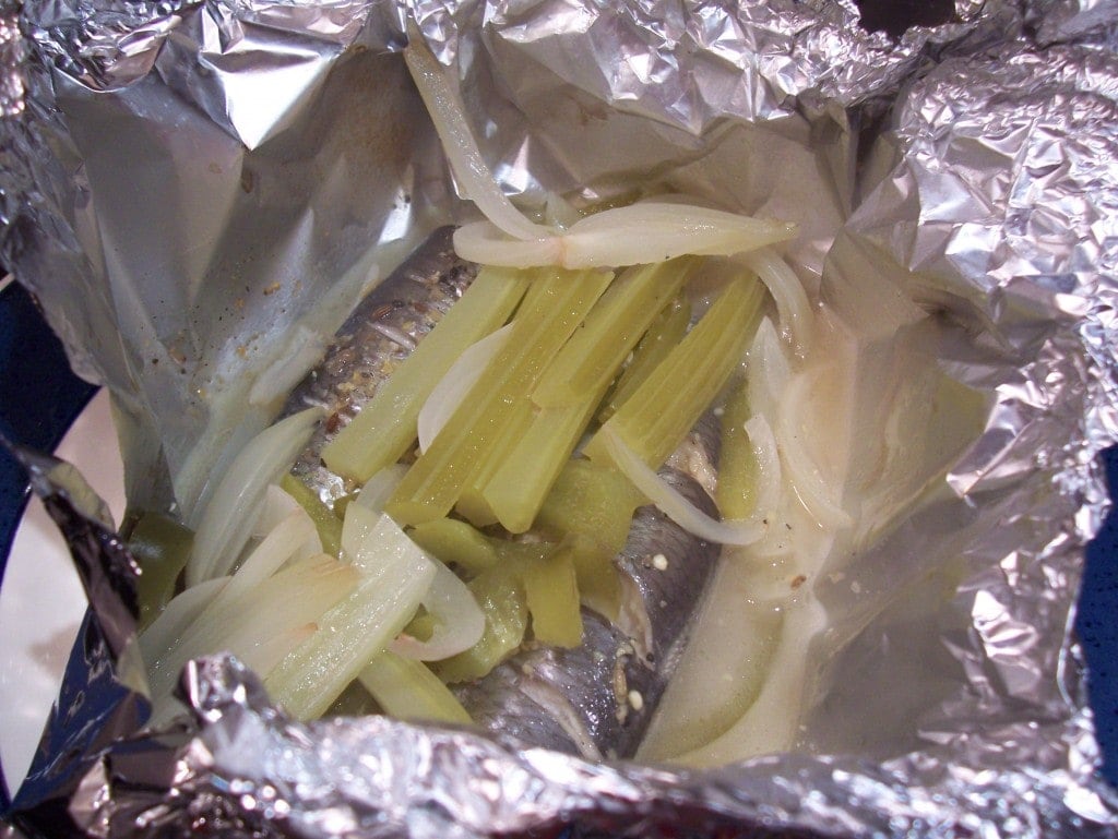 Baked herring in a parcel with vinegar and pickling spices