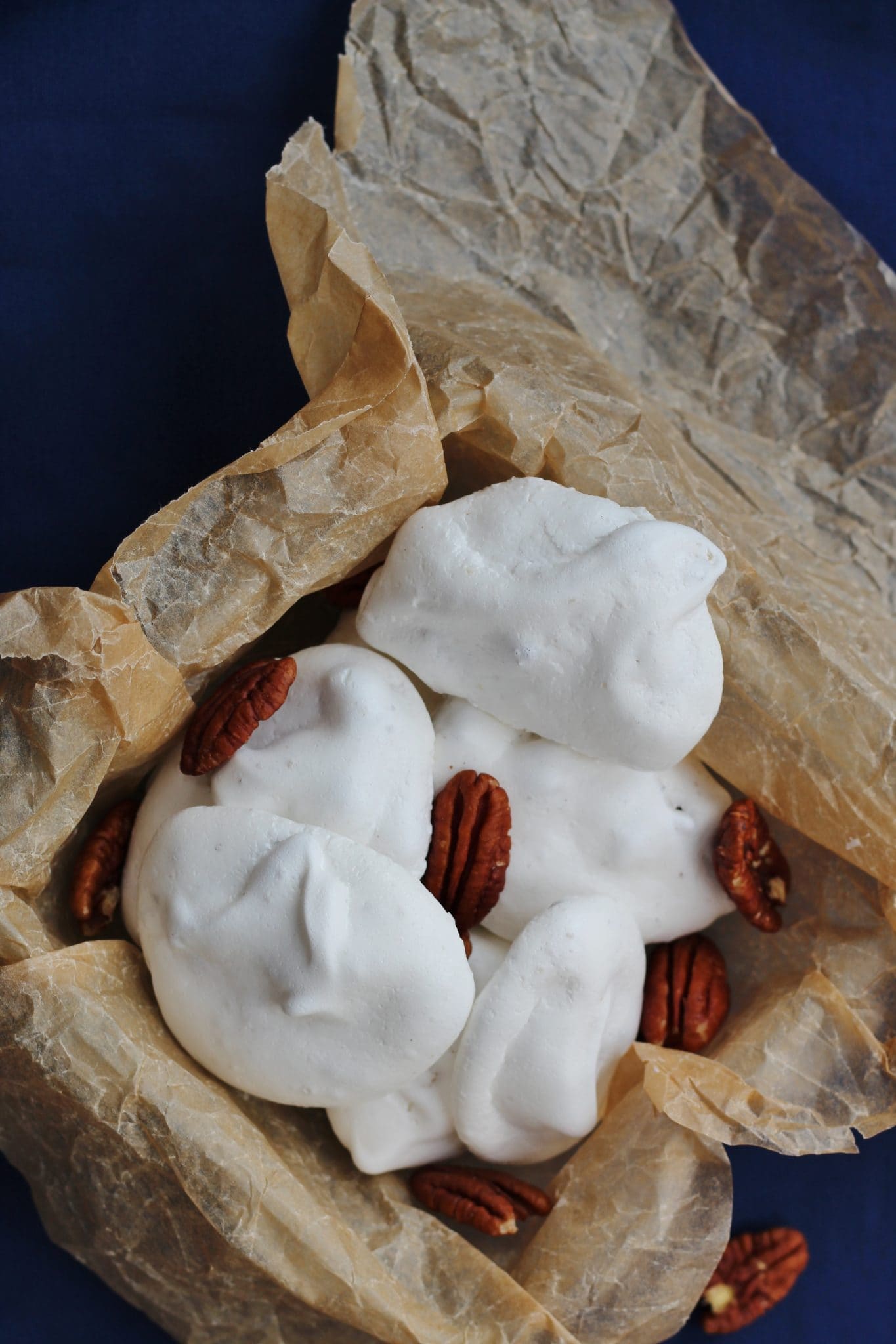 Pecan meringues in a brown paper bag