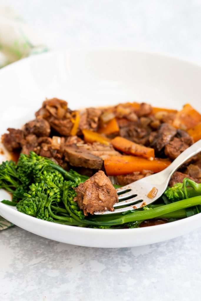 Slow cooker juniper beef stew in a bowl