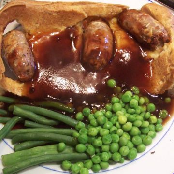 Classic Toad in the hole with peas, beans and gravy