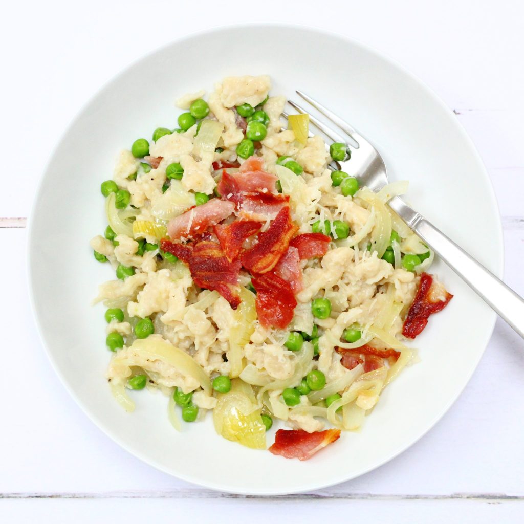 Spaetzle with peas, bacon and caramelised onions