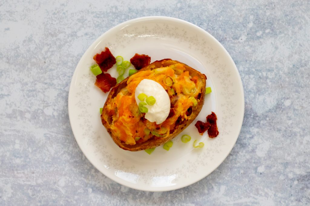 jacket potato stuffed with cheese, bacon and onion