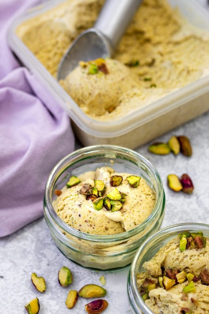 bowls and tub of cardamom pistachio ice cream