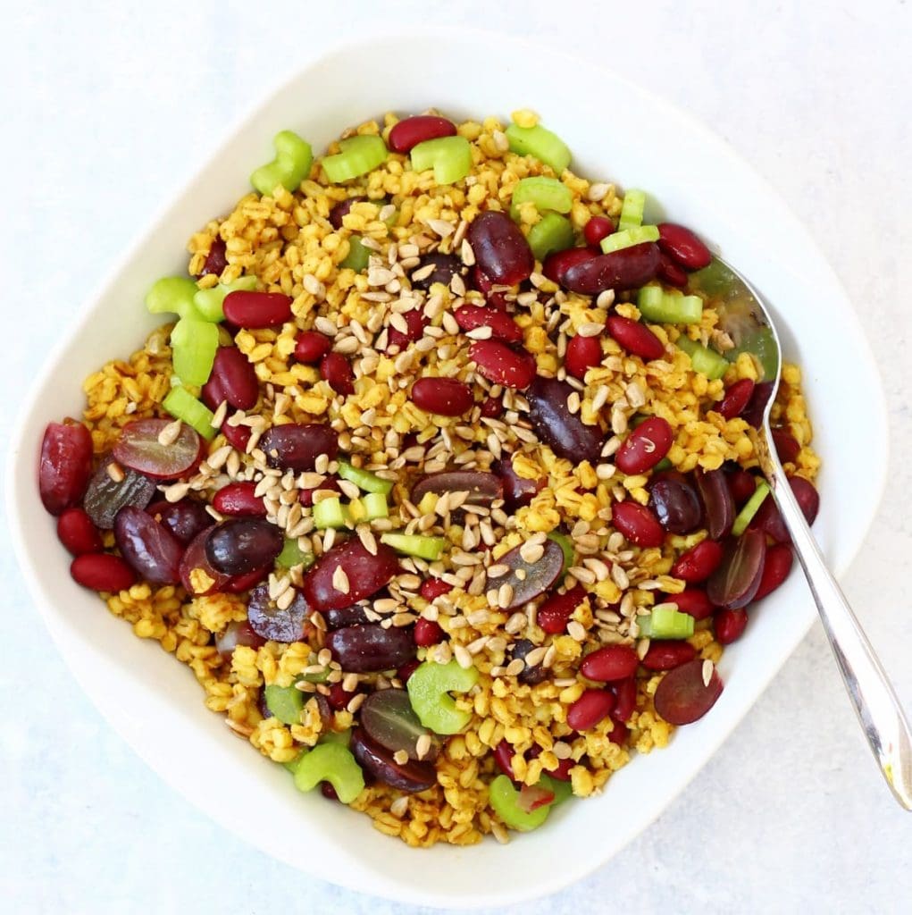 Curried pearl barley salad with grapes, kidney beans and celery