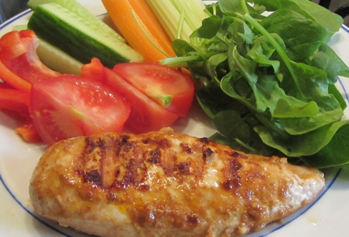 Easy griddled chicken on a plate with salad