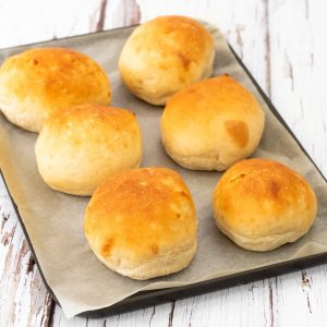 Easy homemade burger buns on a baking tray