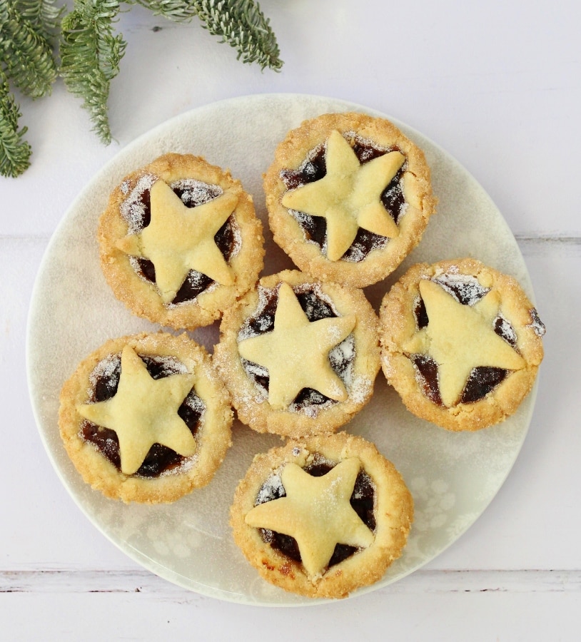 Plate full of mince pies with star shaped top