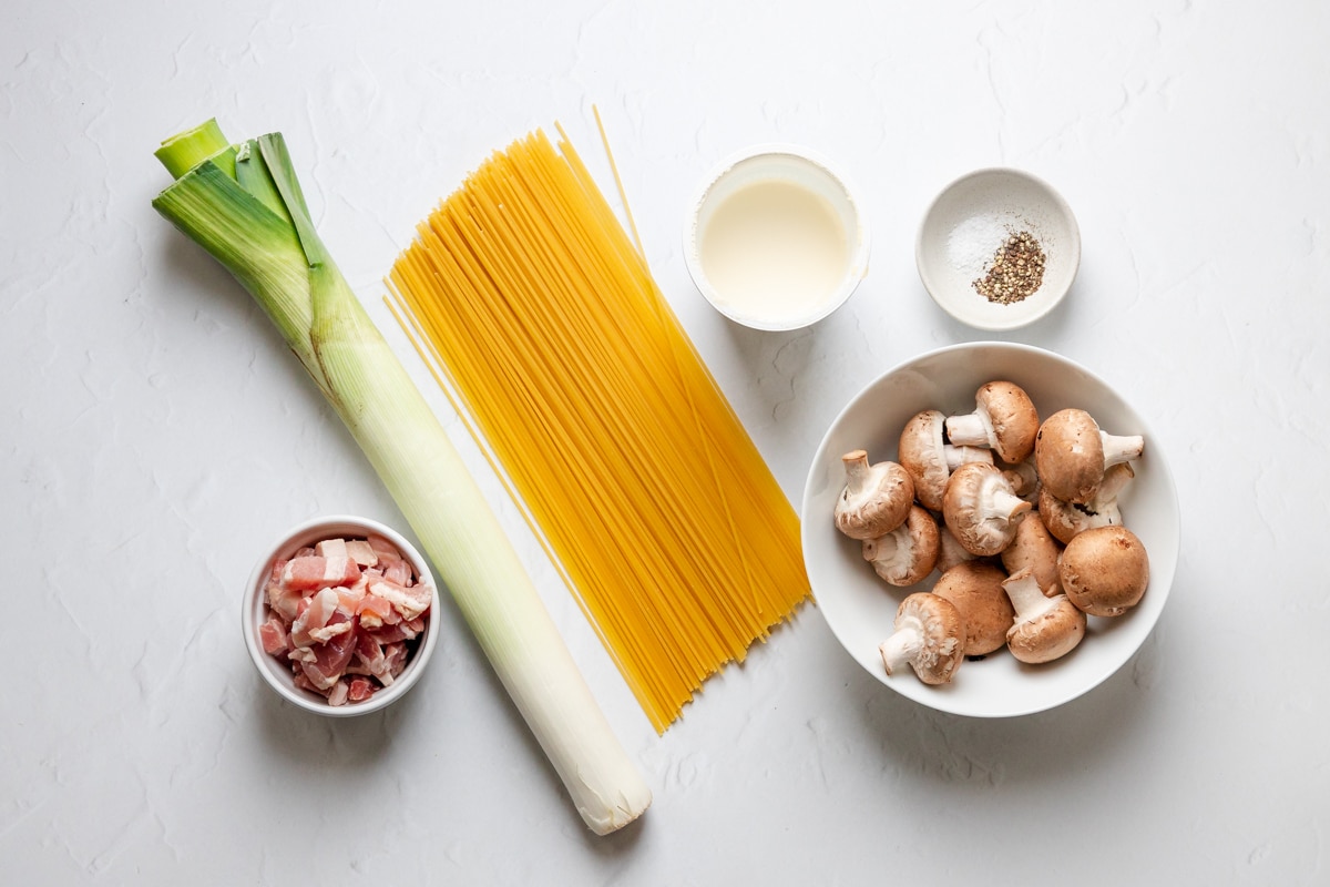 Ingredients for creamy leek bacon mushroom pasta