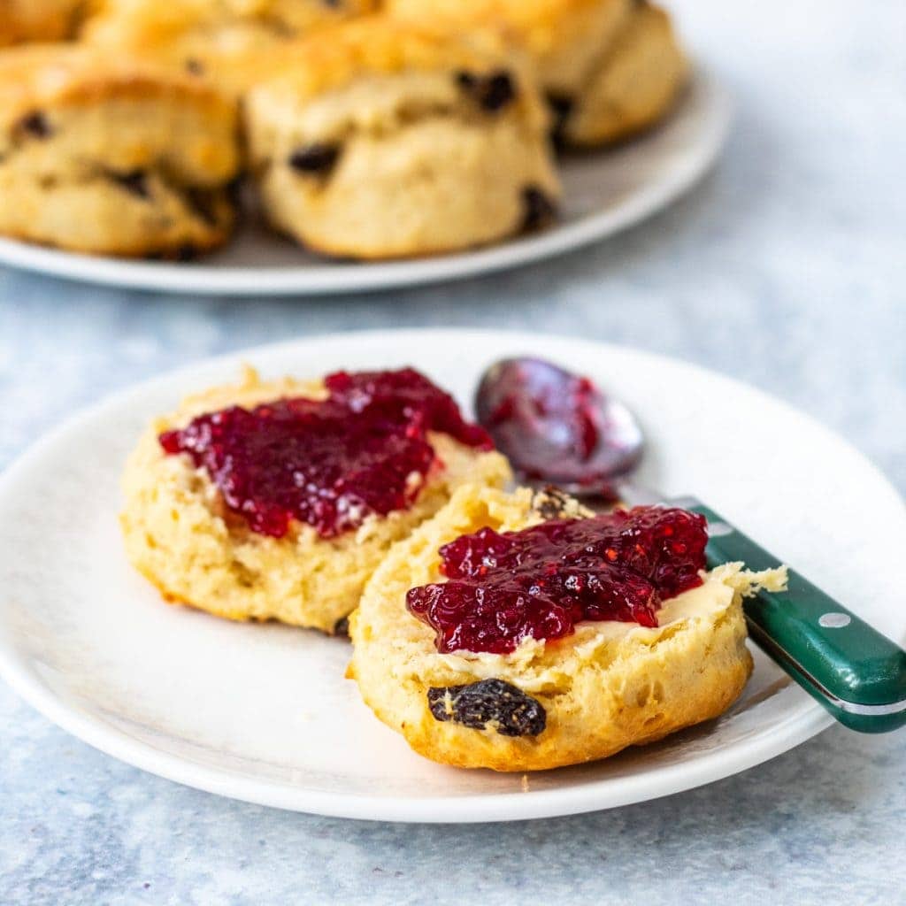 fruit scone on a plate with jam