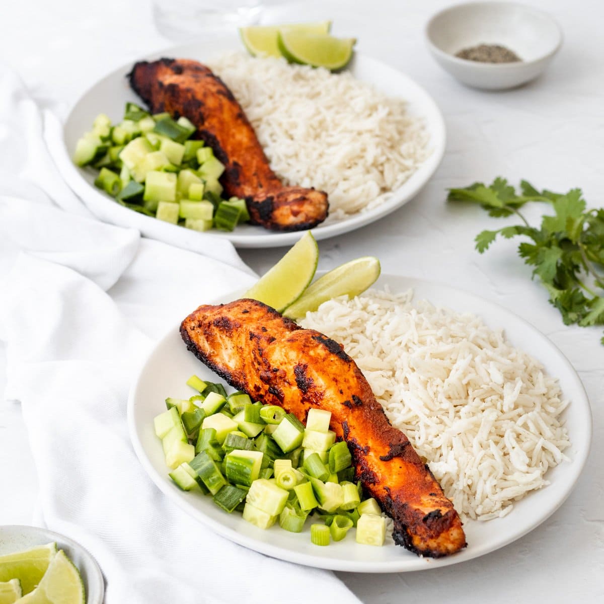 Two bowls of ketchup marinated Indian salmon