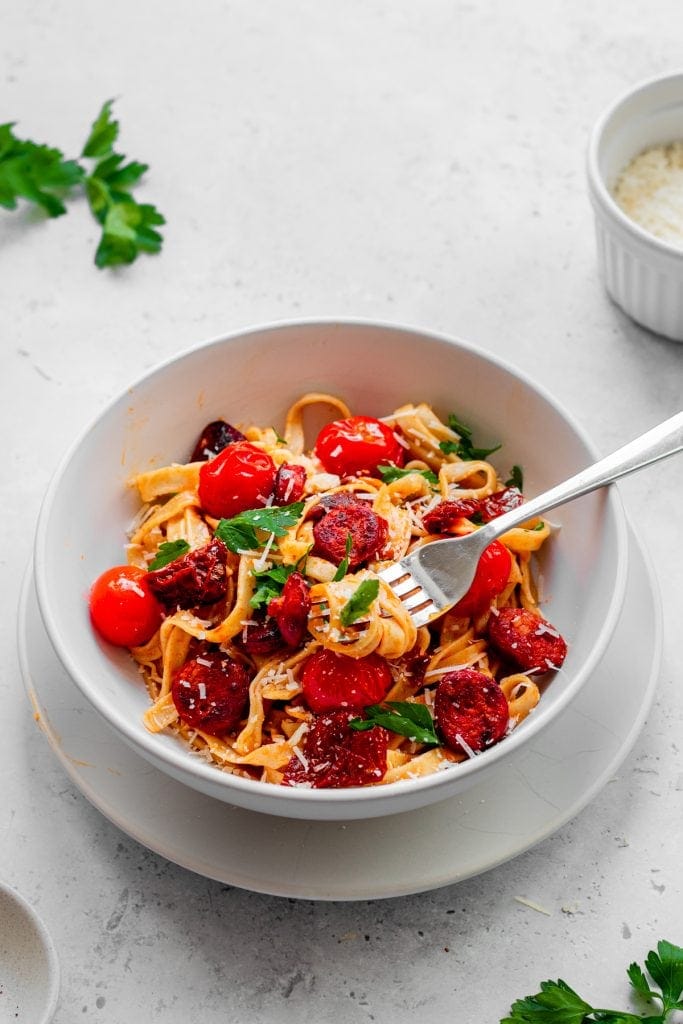 Bowl of pasta with sundried tomatoes and chorizo