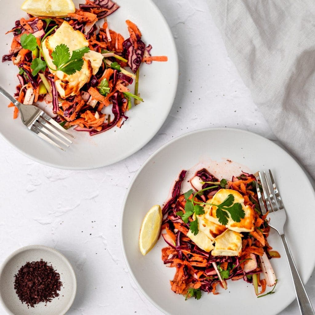 two plates of  halloumi salad with pomegranate molasses