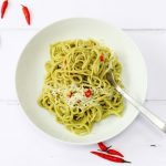 Avocado spaghetti with chilli and lemon juice topped with a little parmesan