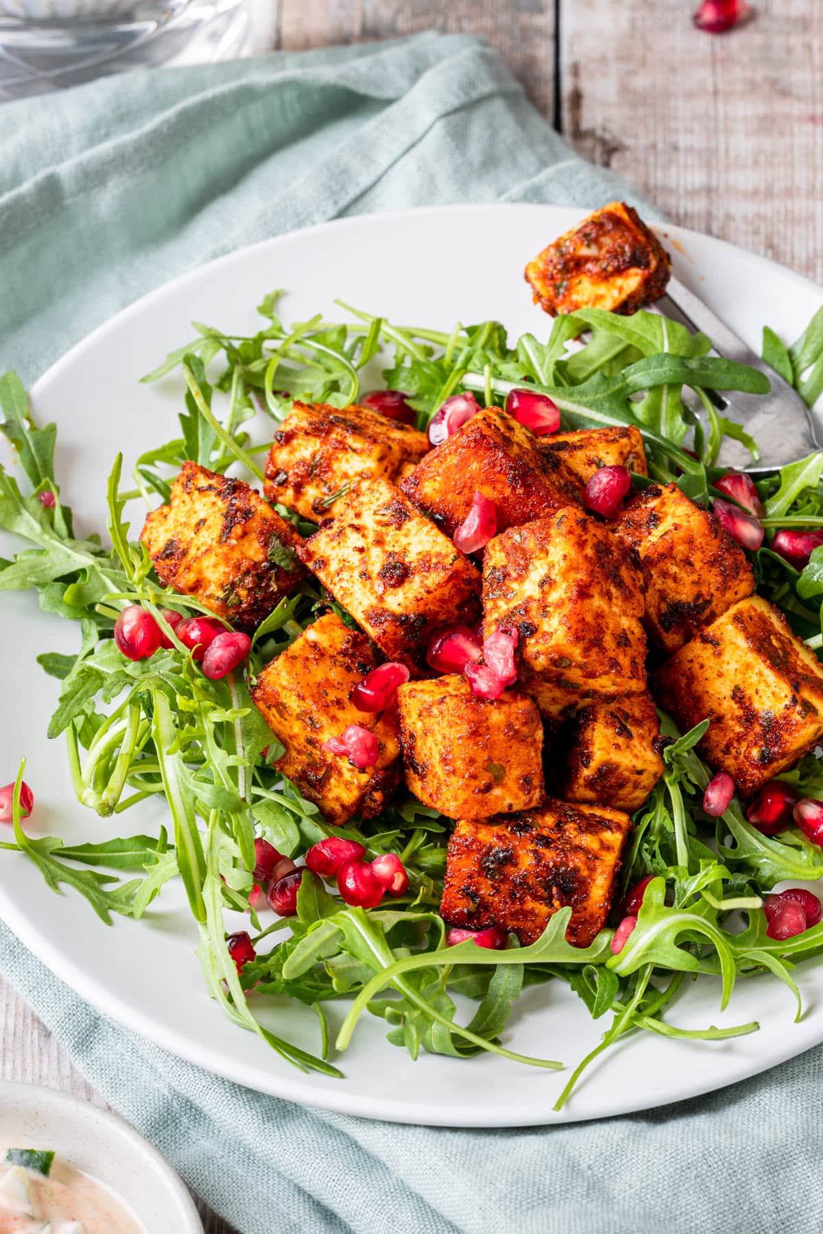 marinated paneer with salad and pomegranate seeds