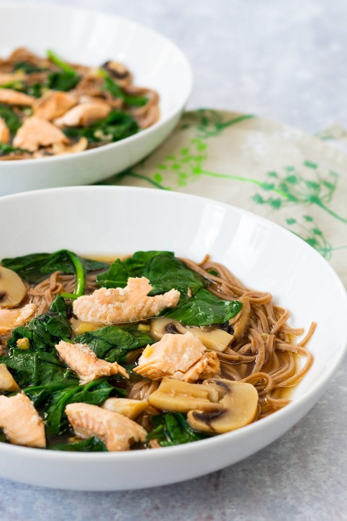 two bowls of salmon miso soup with soba noodles