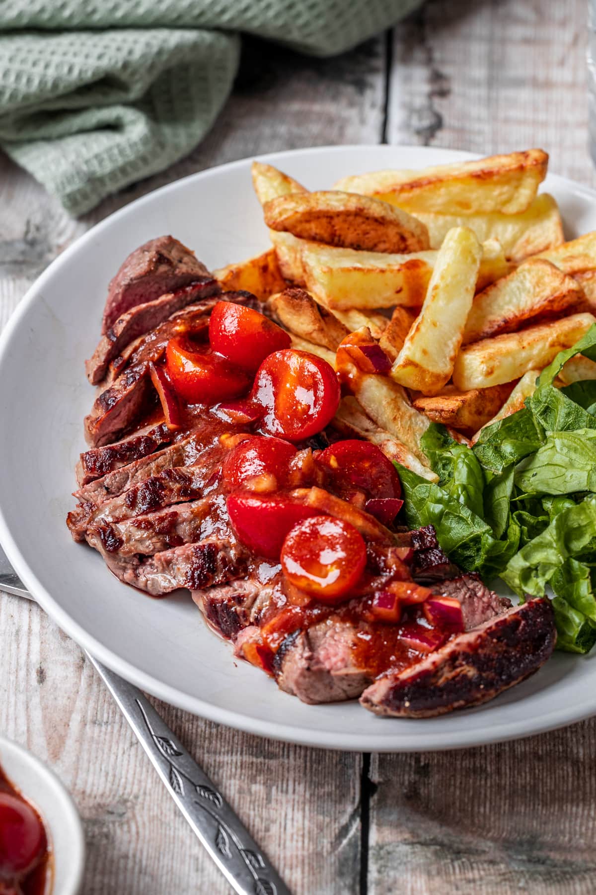 close up of steak topped with bois boudrin sauce