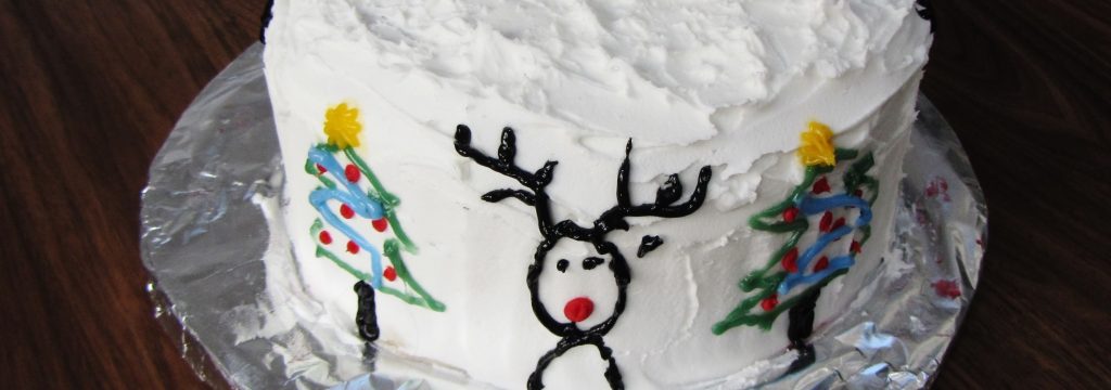 Christmas cake with cider decorated with Rudolph and trees