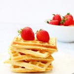 stack of traditional breakfast waffles with strawberries