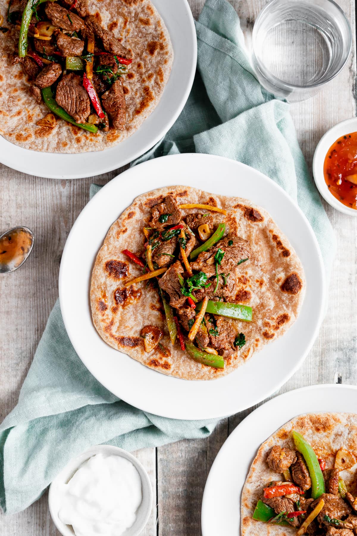 Flatlay of lamb stir fry on wraps