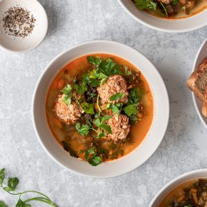 bowl of Romanian sour meatballs soup