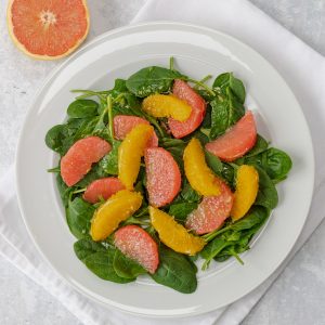 plate of spinach and citrus salad