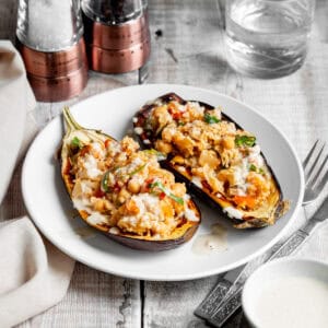 two aubergine halves stuffed with couscous