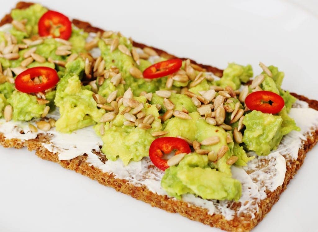 Jamie Oliver avocado sunflower seeds and sliced chillli peppers on rye bread