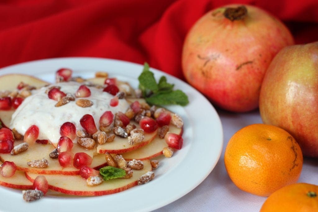 Apple carpaccio with pomegranate seeds