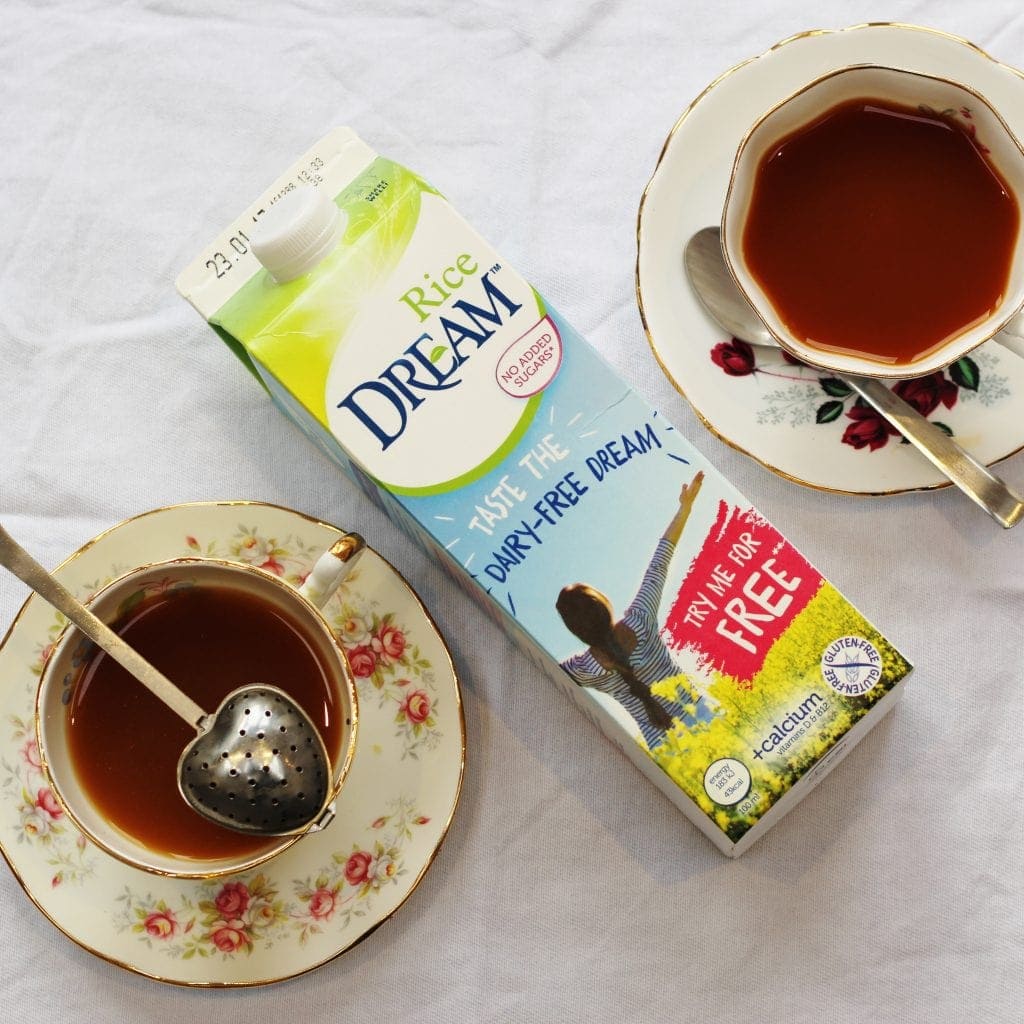 Carton of Rice Dream with two cups of tea