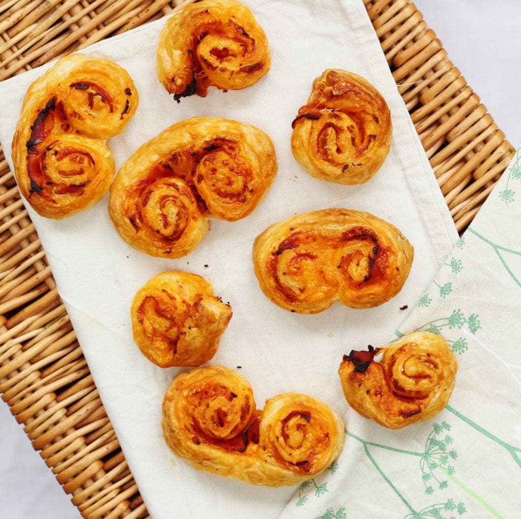 Cheesy chorizo pastries on a picnic basket