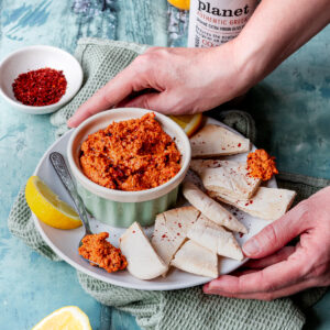 Bowl of muhammara with pita bread chips