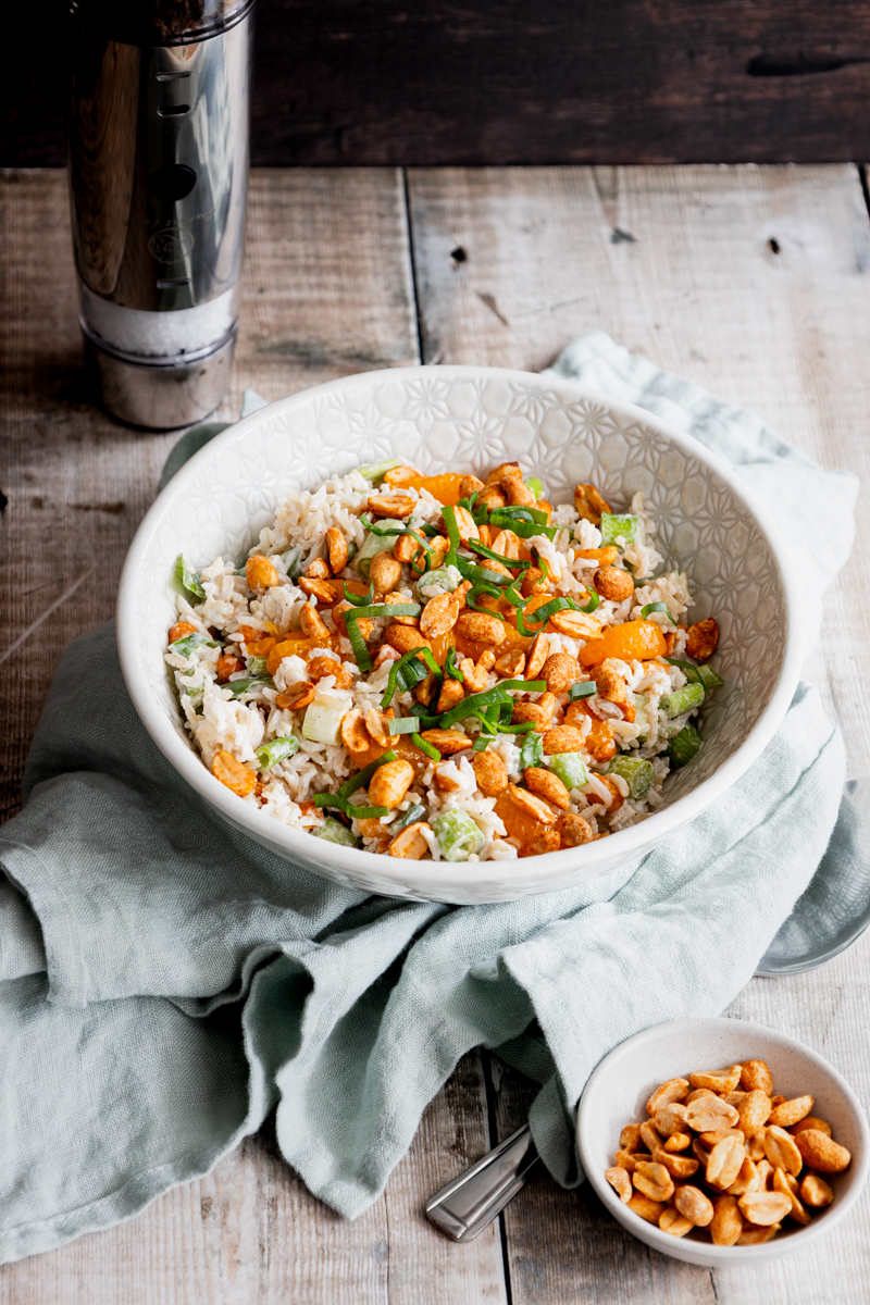 bowl or rice salad with dry roasted peanuts and mandarin oranges