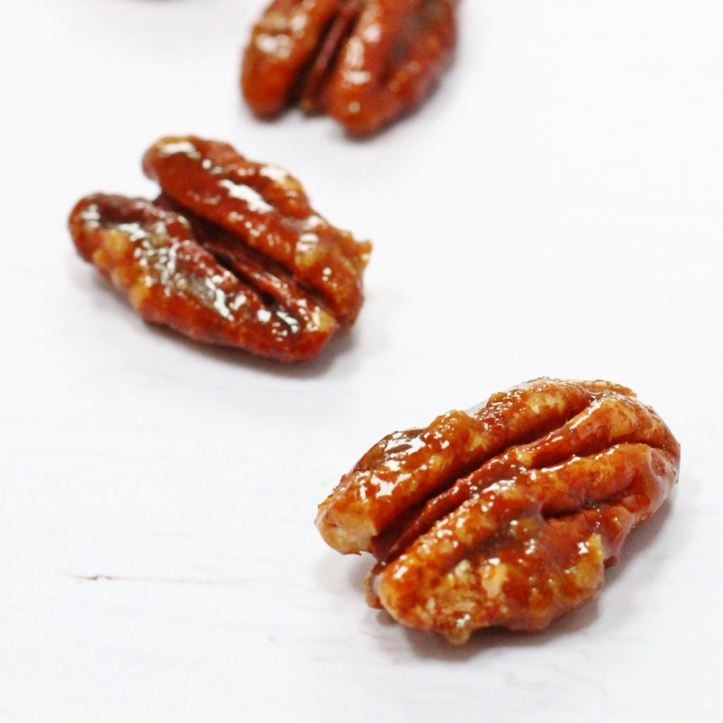 Three caramelised pecans