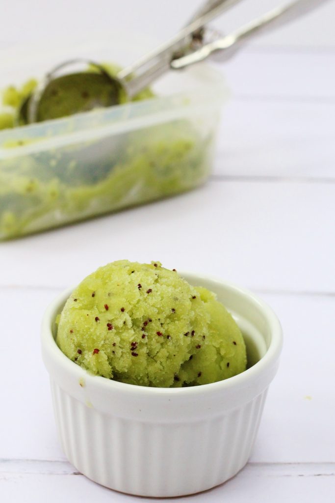 Kiwi sorbet in abowl with a box of sorbet behind