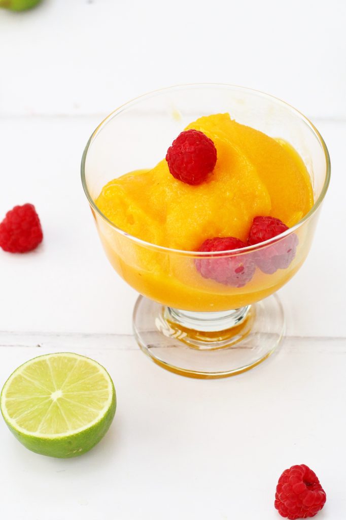 Mango sorbet with lime in a glass bowl