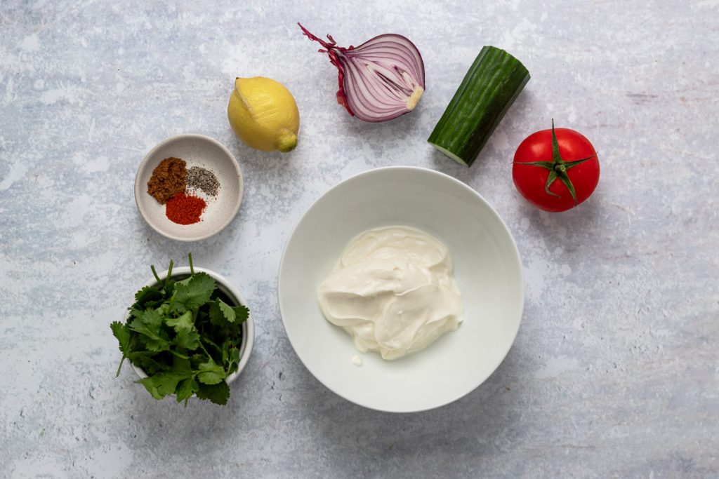 Ingredients for tomato cucumber and onion raita