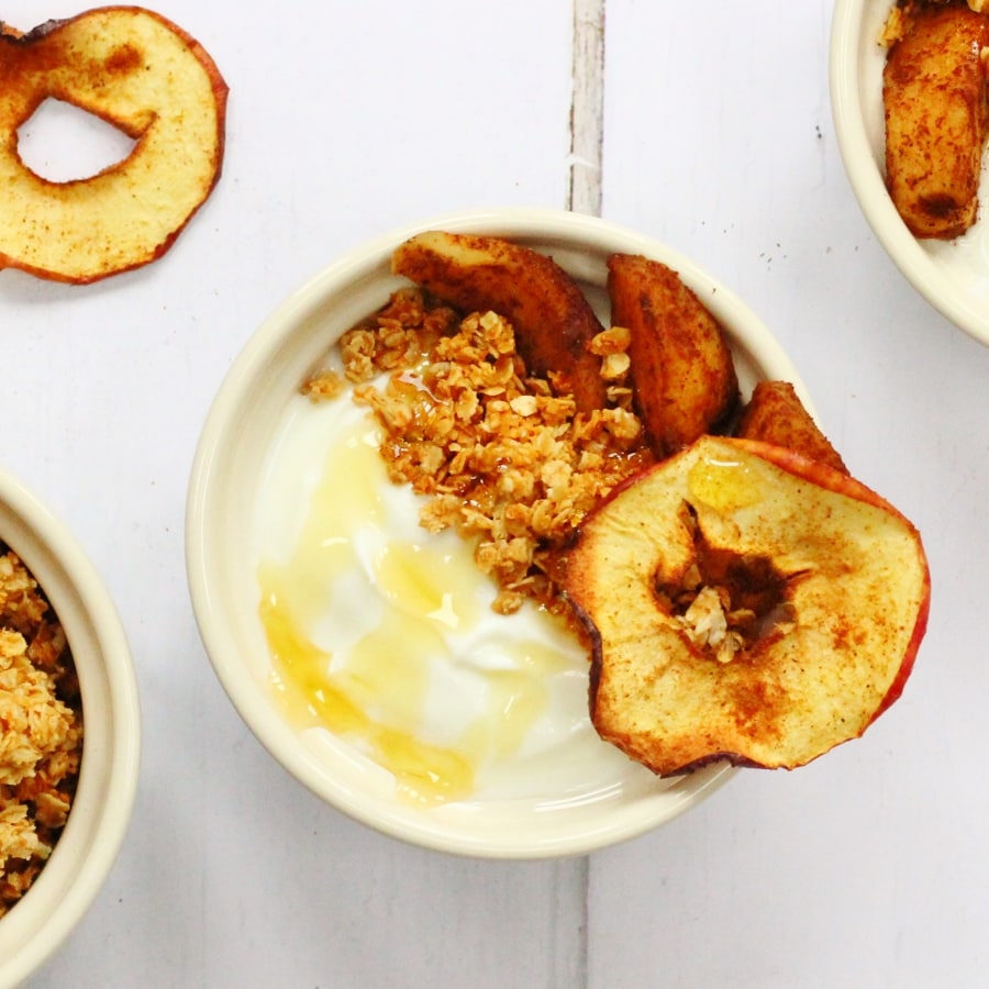 quark apple cinnamon breakfast bowl topped with honey and granola