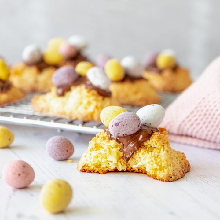 Coconut macaroons topped with chocolate and mini eggs