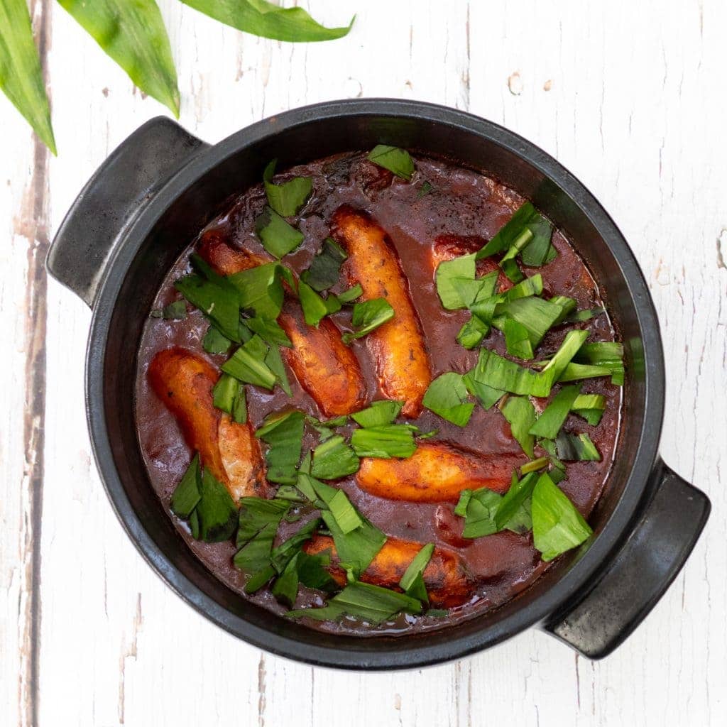 sausage and wild garlic stew in a pot