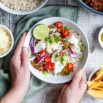 hands holding bowl of healthy chilli con carne with hidden vegetables