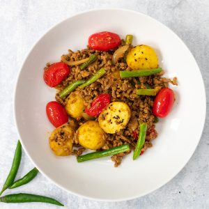 white bowl with Bombay lamb curry in