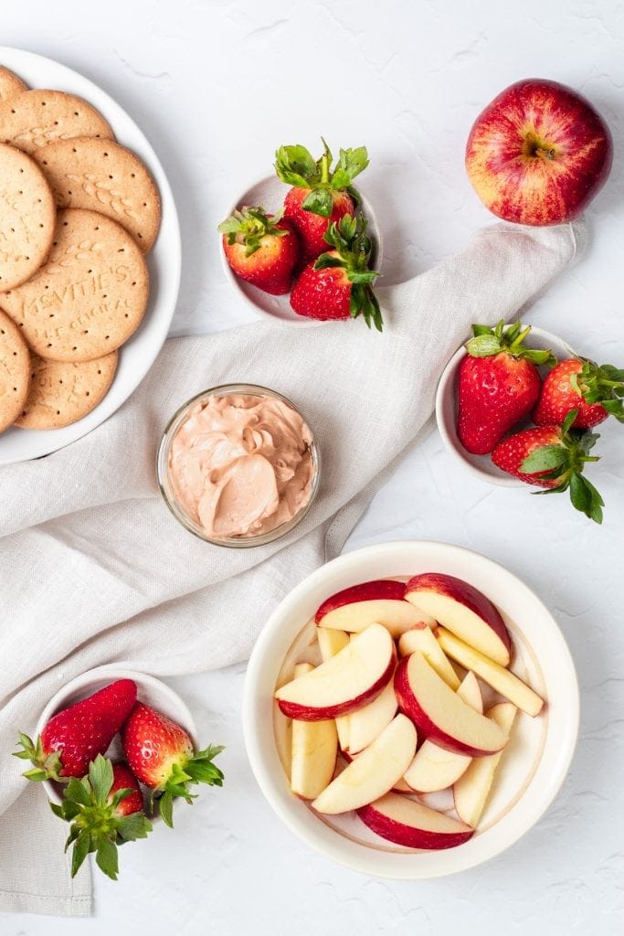 Chocolate cheesecake dip with apple slices and strawberries