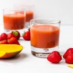 glass of strawberry mango smoothie with ginger