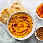 bowl of spicy roasted carrot hummus