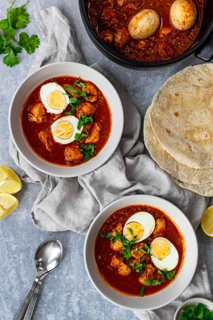 pot and two bowls of doro wat