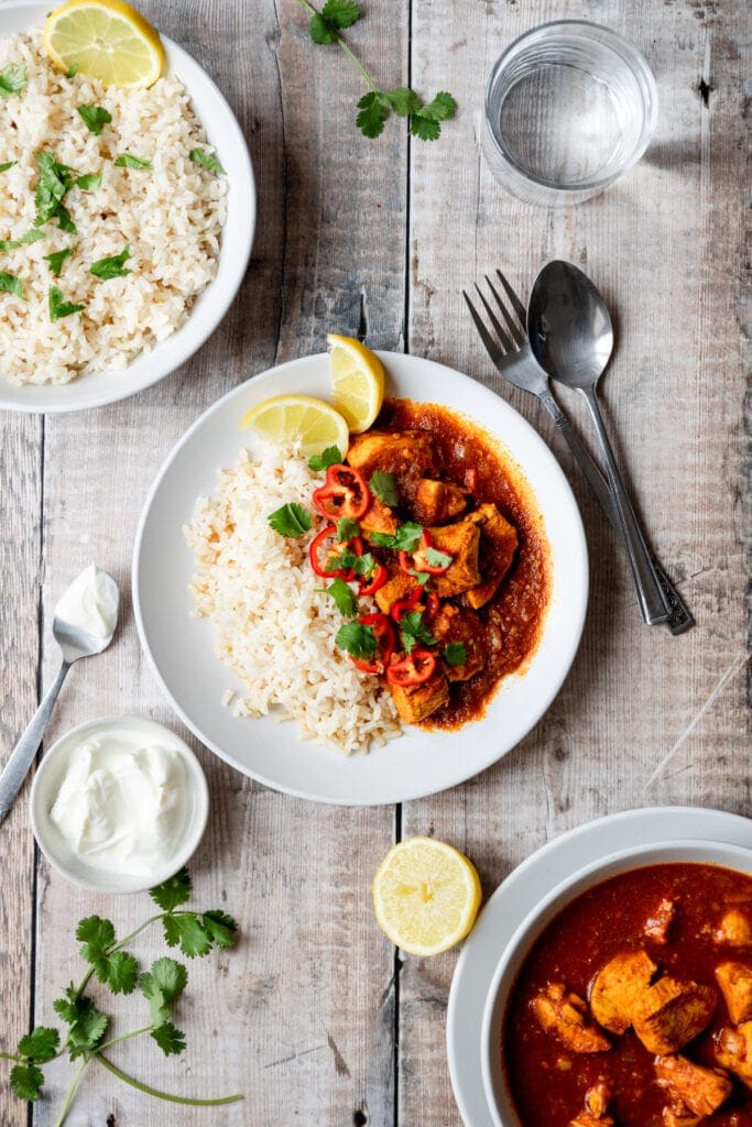 flatlay of chicken patia curry and rice