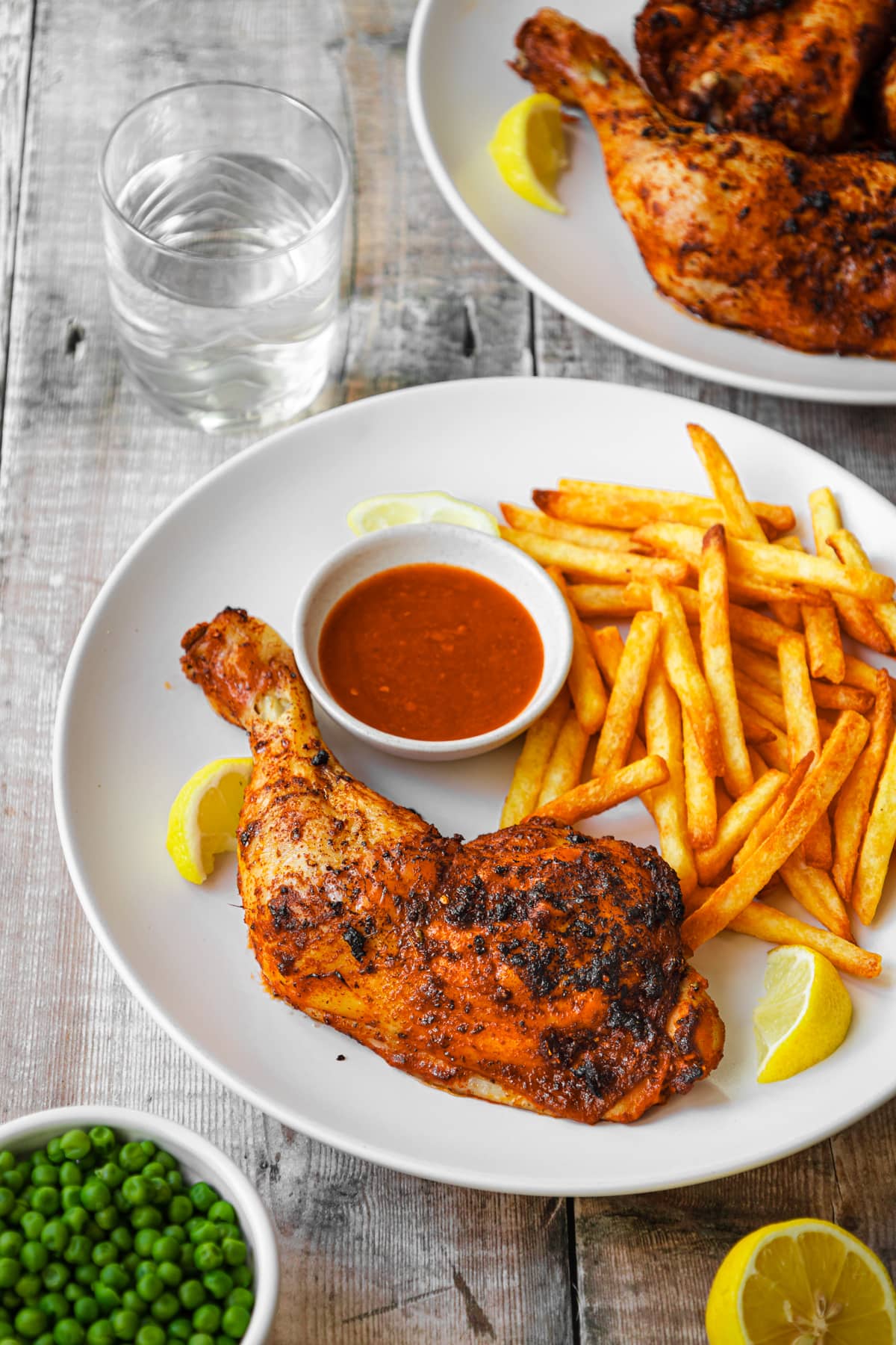 plate of Nandos copycat chicken legs with fries